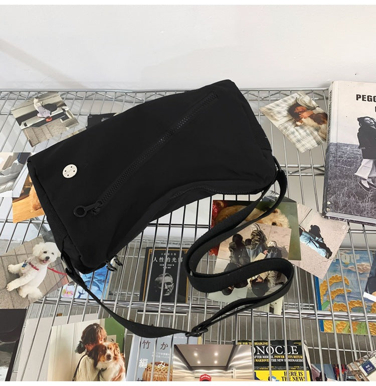 An elegant black shoulder bag for travel and work