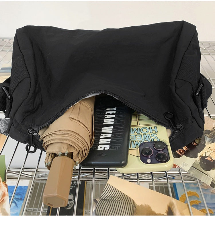 An elegant black shoulder bag for travel and work