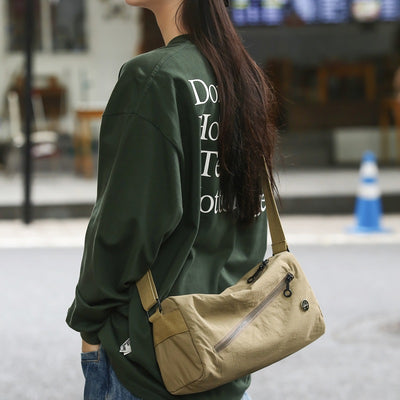 An elegant khaki shoulder bag for travel and work